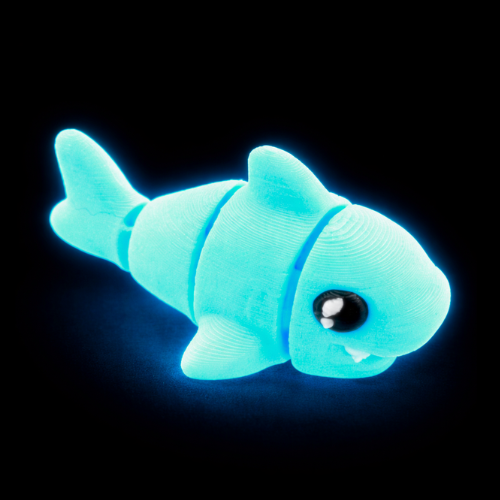Finn the Shark Flexling toy in glowing blue SFX edition, bendable fidget collectible for kids ages 6 and up