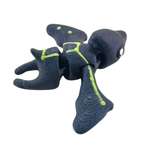 Lamar the Pteranodon Constellation Edition glow in the dark Flexling toy with galaxy coloring and Musca star pattern