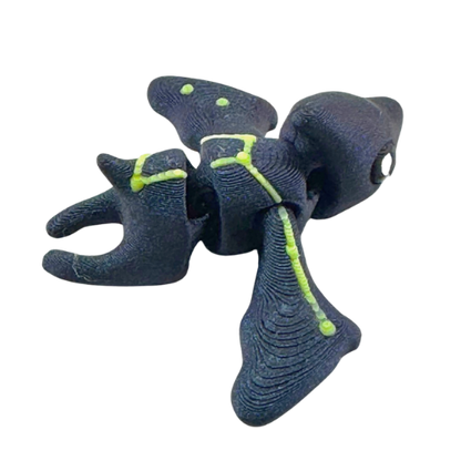 Lamar the Pteranodon Constellation Edition glow in the dark Flexling toy with galaxy coloring and Musca star pattern