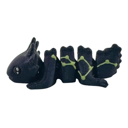 Lumi the Axolotl Constellation Edition Flexlings toy with glow-in-the-dark Lacerta constellation pattern on pink axolotl figure