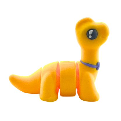 Monty the Brachiosaurus Flexling toy in yellow with purple fancy bow tie, limited edition collectible dinosaur figure