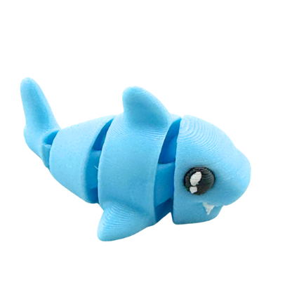 Finn the Shark Flexling toy in glowing blue SFX edition, bendable fidget collectible for kids ages 6 and up