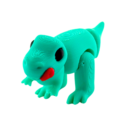 Roary the T-Rex Nom Nom Edition collectible toy in shimmery turquoise finish with tongue out in playful hungry pose
