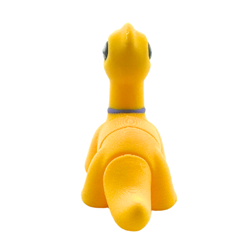 Monty the Brachiosaurus Flexling toy in yellow with purple fancy bow tie, limited edition collectible dinosaur figure