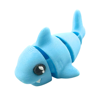 Finn the Shark Flexling toy in glowing blue SFX edition, bendable fidget collectible for kids ages 6 and up