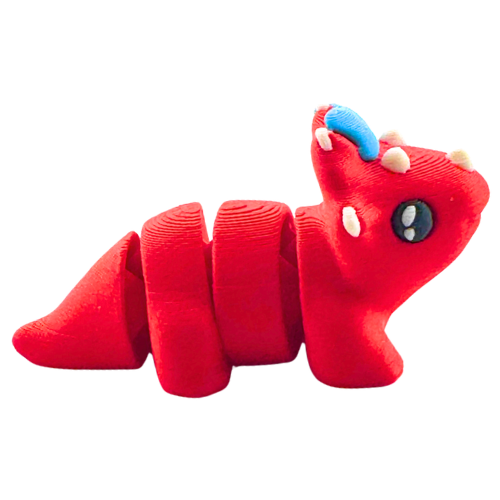 Red triceratops toy with large blue bow on frill, Fancy Edition collectible figure