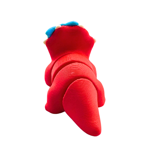 Red triceratops toy with large blue bow on frill, Fancy Edition collectible figure