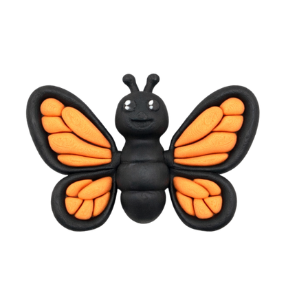 Aurora the Butterfly Flexling with black body and iridescent blue-green wings, poseable collectible toy from Original Crew