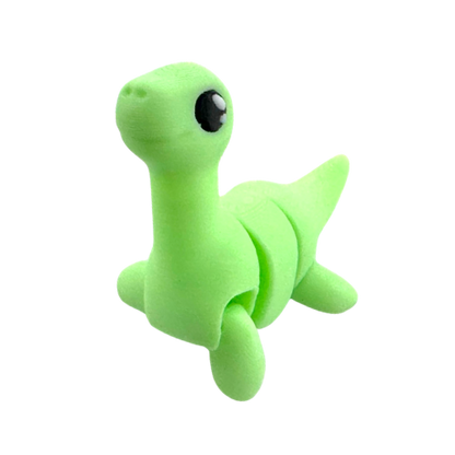 Nessie the Loch Ness Monster glow-in-the-dark Flexling fidget toy with bendable body and friendly expression