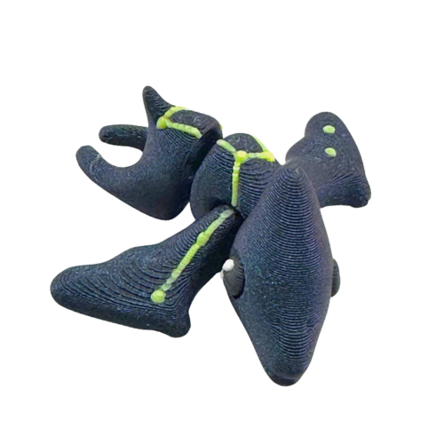 Lamar the Pteranodon Constellation Edition glow in the dark Flexling toy with galaxy coloring and Musca star pattern