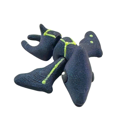 Lamar the Pteranodon Constellation Edition glow in the dark Flexling toy with galaxy coloring and Musca star pattern