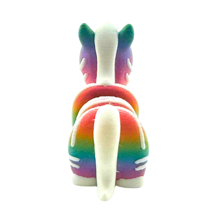 Debra the Zebra Rainbow Edition Flexling toy with gradient colors flowing across white stripes, palm-sized collectible