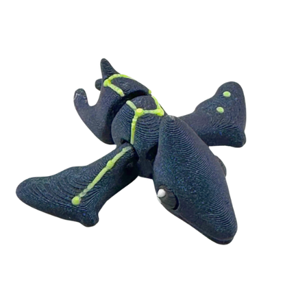 Lamar the Pteranodon Constellation Edition glow in the dark Flexling toy with galaxy coloring and Musca star pattern