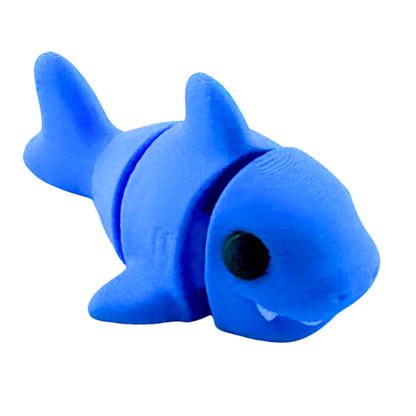 Finn the Shark blue poseable fidget toy from Flexlings Original Crew edition in racing pose