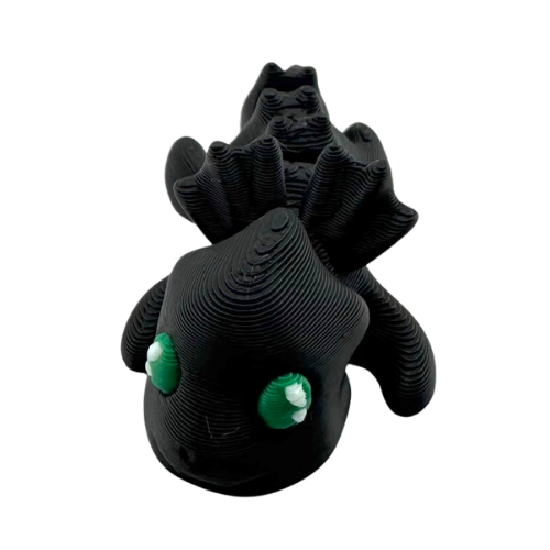Ember the Dragon Flexling toy in dark gray with black eyes, poseable dragon figure from limited Original Crew edition
