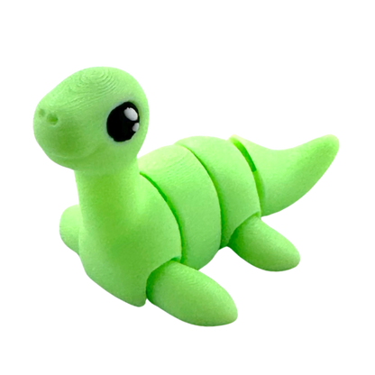 Nessie the Loch Ness Monster glow-in-the-dark Flexling fidget toy with bendable body and friendly expression