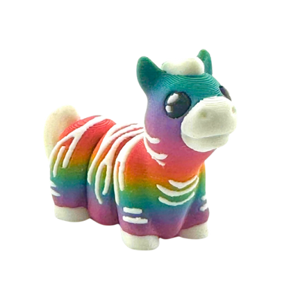 Debra the Zebra Rainbow Edition Flexling toy with gradient colors flowing across white stripes, palm-sized collectible