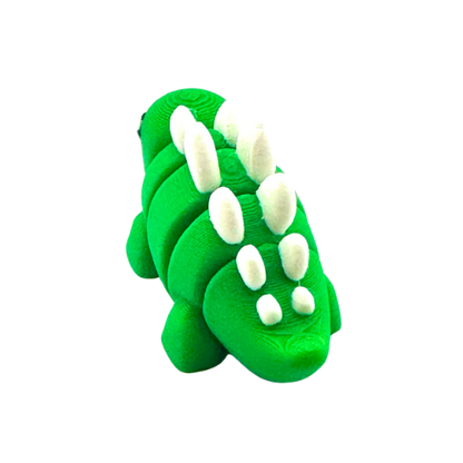 Plato the Stegosaurus green poseable dinosaur toy from Flexlings Original Crew, thoughtful expression, limited edition