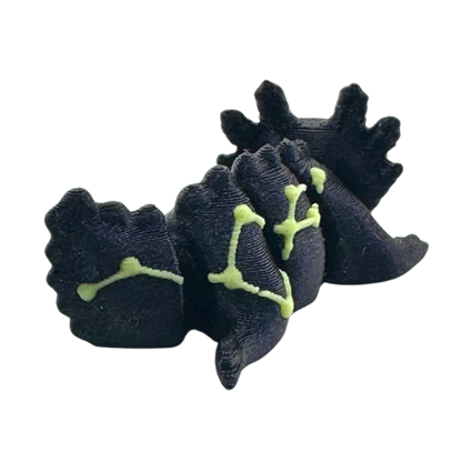 Lumi the Axolotl Constellation Edition Flexlings toy with glow-in-the-dark Lacerta constellation pattern on pink axolotl figure