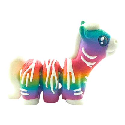 Debra the Zebra Rainbow Edition Flexling toy with gradient colors flowing across white stripes, palm-sized collectible