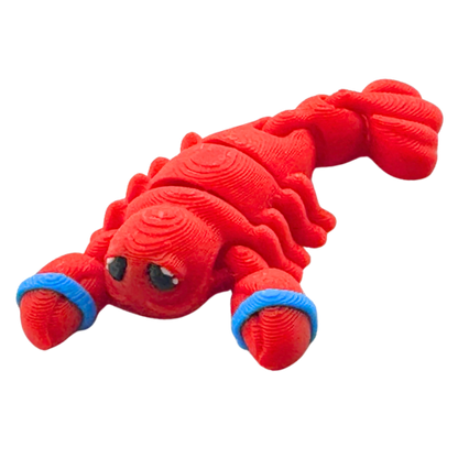 Red poseable lobster toy with blue rubber bands on claws, Clawdia the Lobster Caught Edition by Flexlings