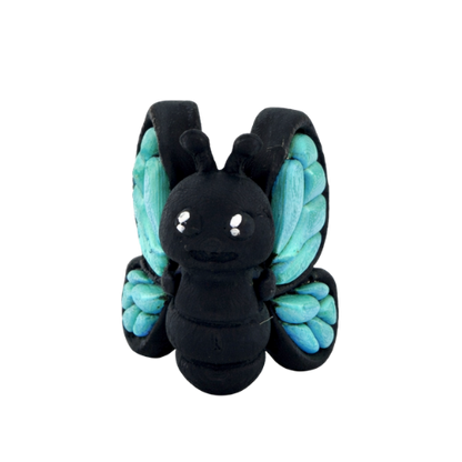Aurora Butterfly Monarch Queen Flexling toy with orange glow-in-the-dark wings, ultra-limited edition of 23