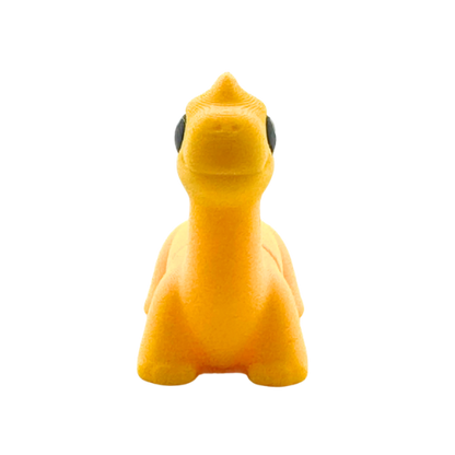 Monty the Brachiosaurus yellow poseable dinosaur figure wearing bow tie from Flexlings Original Crew collection