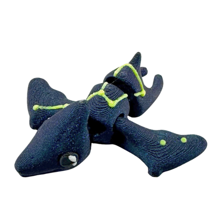 Lamar the Pteranodon Constellation Edition glow in the dark Flexling toy with galaxy coloring and Musca star pattern