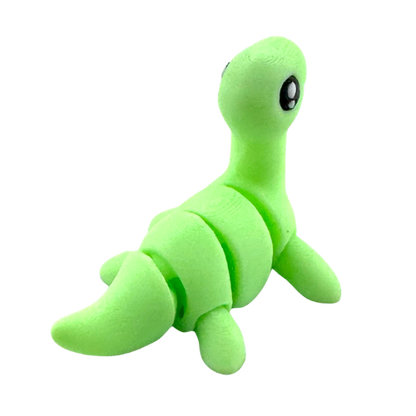 Nessie the Loch Ness Monster glow-in-the-dark Flexling fidget toy with bendable body and friendly expression