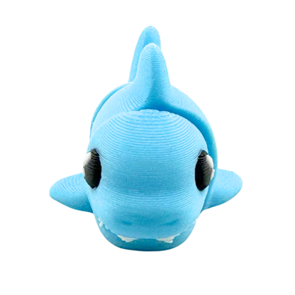 Finn the Shark Flexling toy in glowing blue SFX edition, bendable fidget collectible for kids ages 6 and up