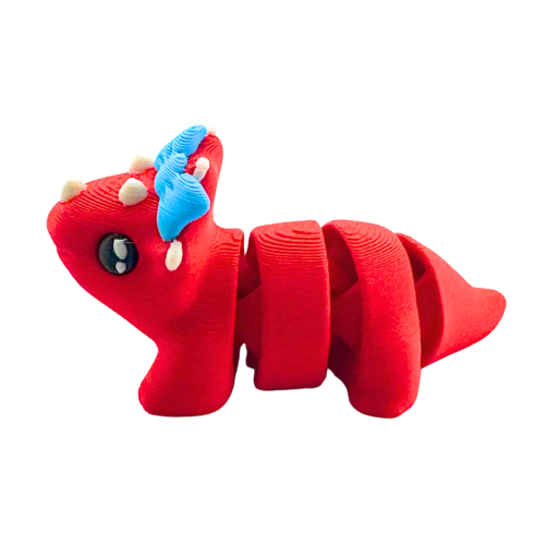 Red triceratops toy with large blue bow on frill, Fancy Edition collectible figure